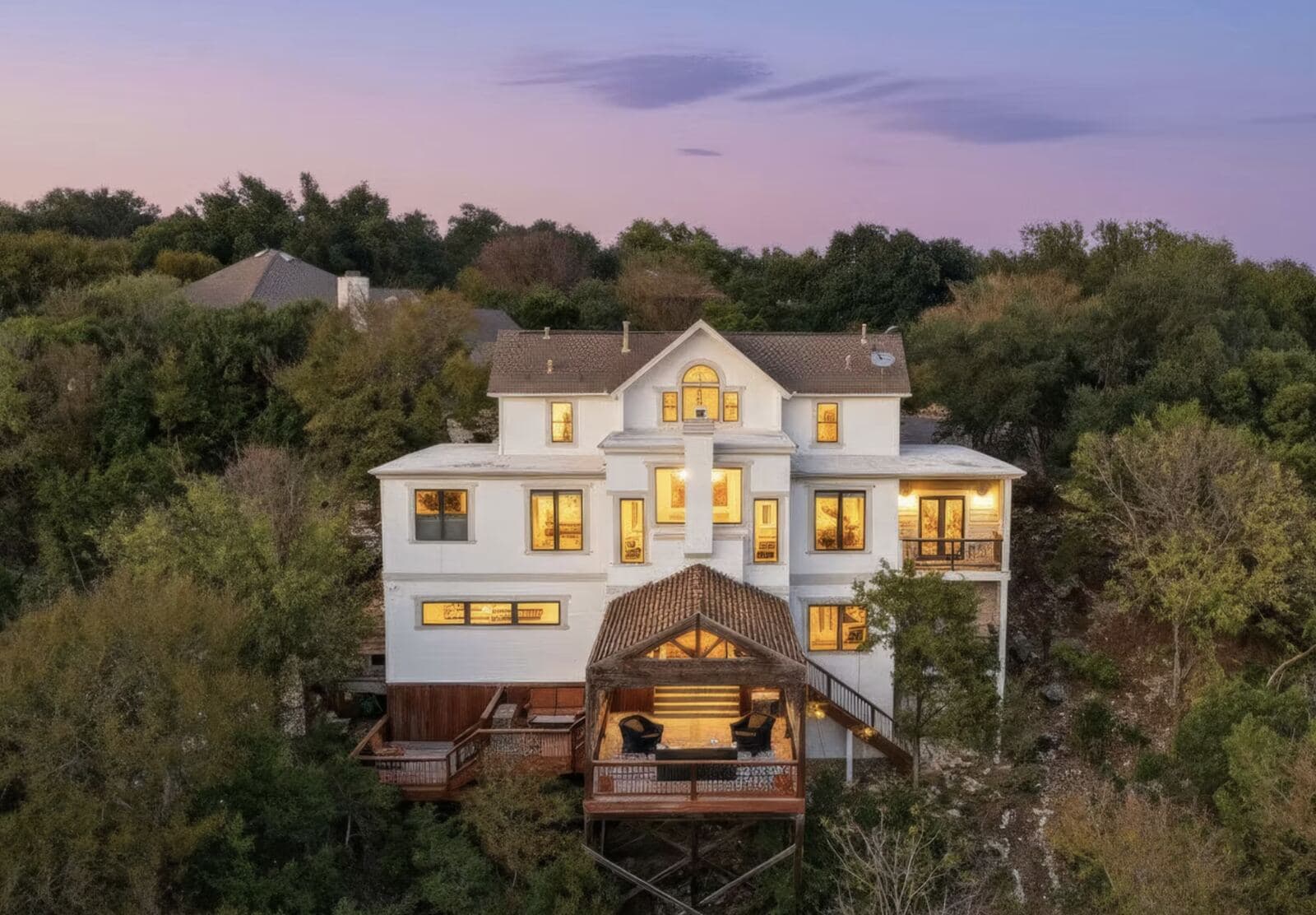 Aerial twilight photo of a hillside home